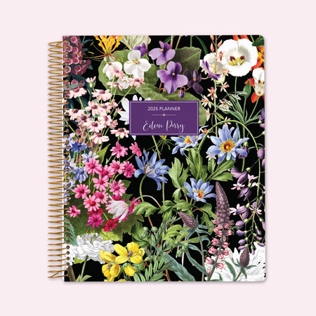 8.5x11 teacher planner with a colorful florals black cover, blending elegant dark backgrounds with vibrant flowers, high-quality paper, and organized planning spreads.
