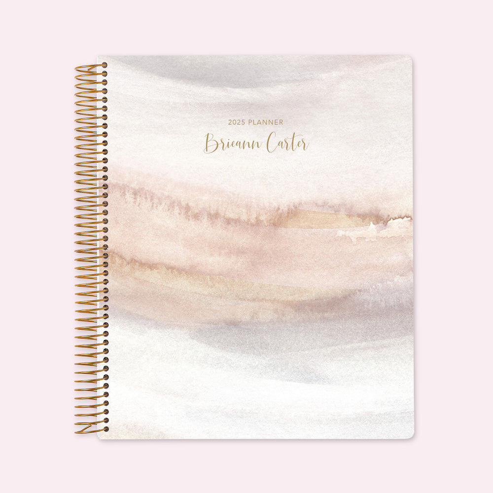 8.5x11 teacher planner with a neutral watercolor gradient cover, blending soft earthy tones with smooth writing paper and structured lesson planning spreads.
