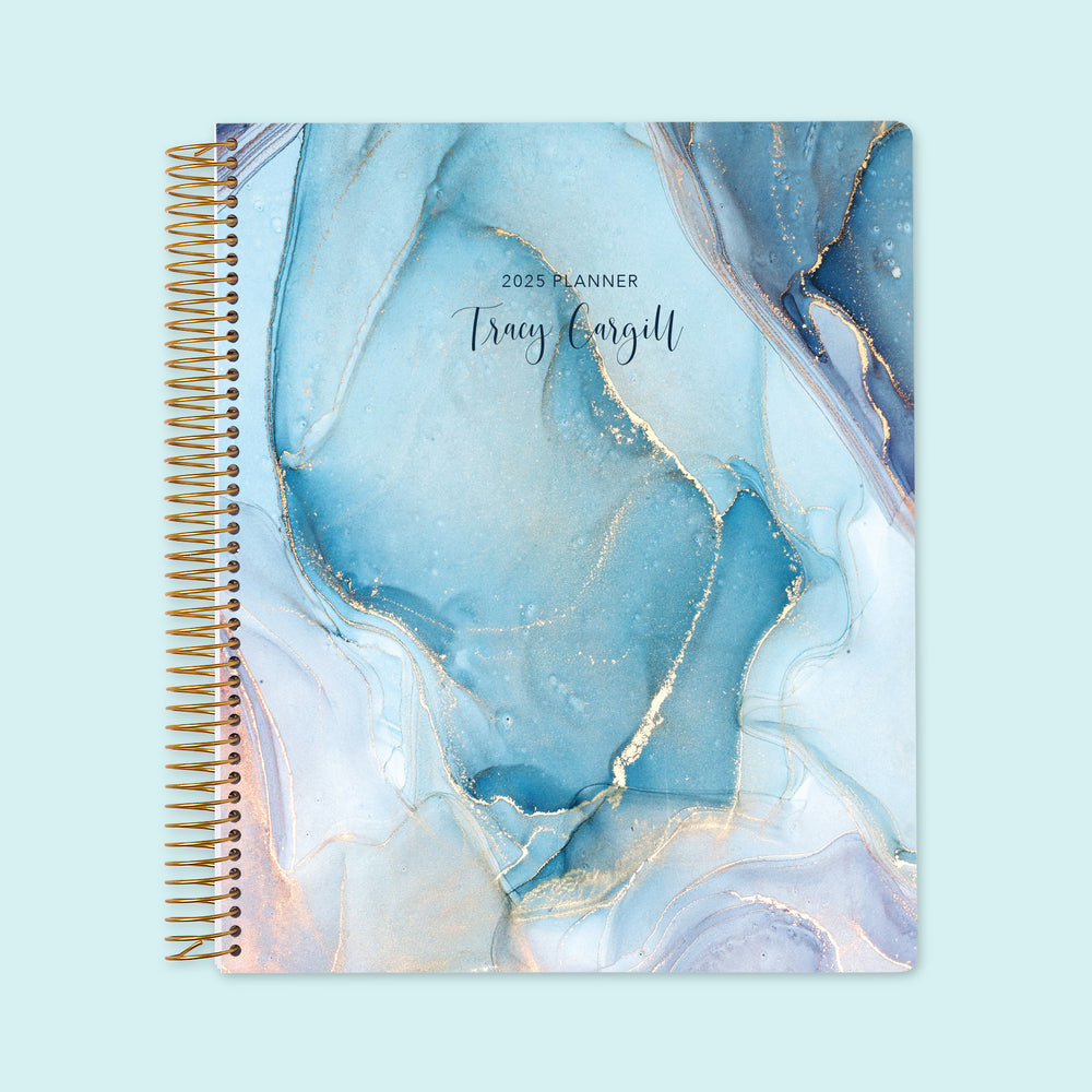 Large weekly planner with an Aqua Gold Abstract Ink cover, featuring marbled gold accents, premium writing paper, and smooth scheduling layouts.