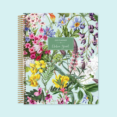 Large weekly planner with a Colorful Florals Green cover, blending vibrant floral patterns with premium layouts for streamlined organization.