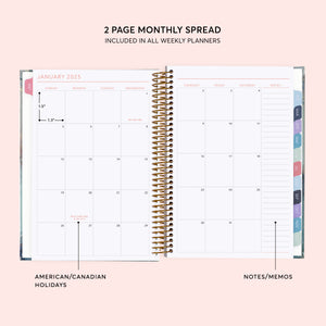 
                  
                    Two-page monthly calendar spread with a notes column and colored month tabs.
                  
                