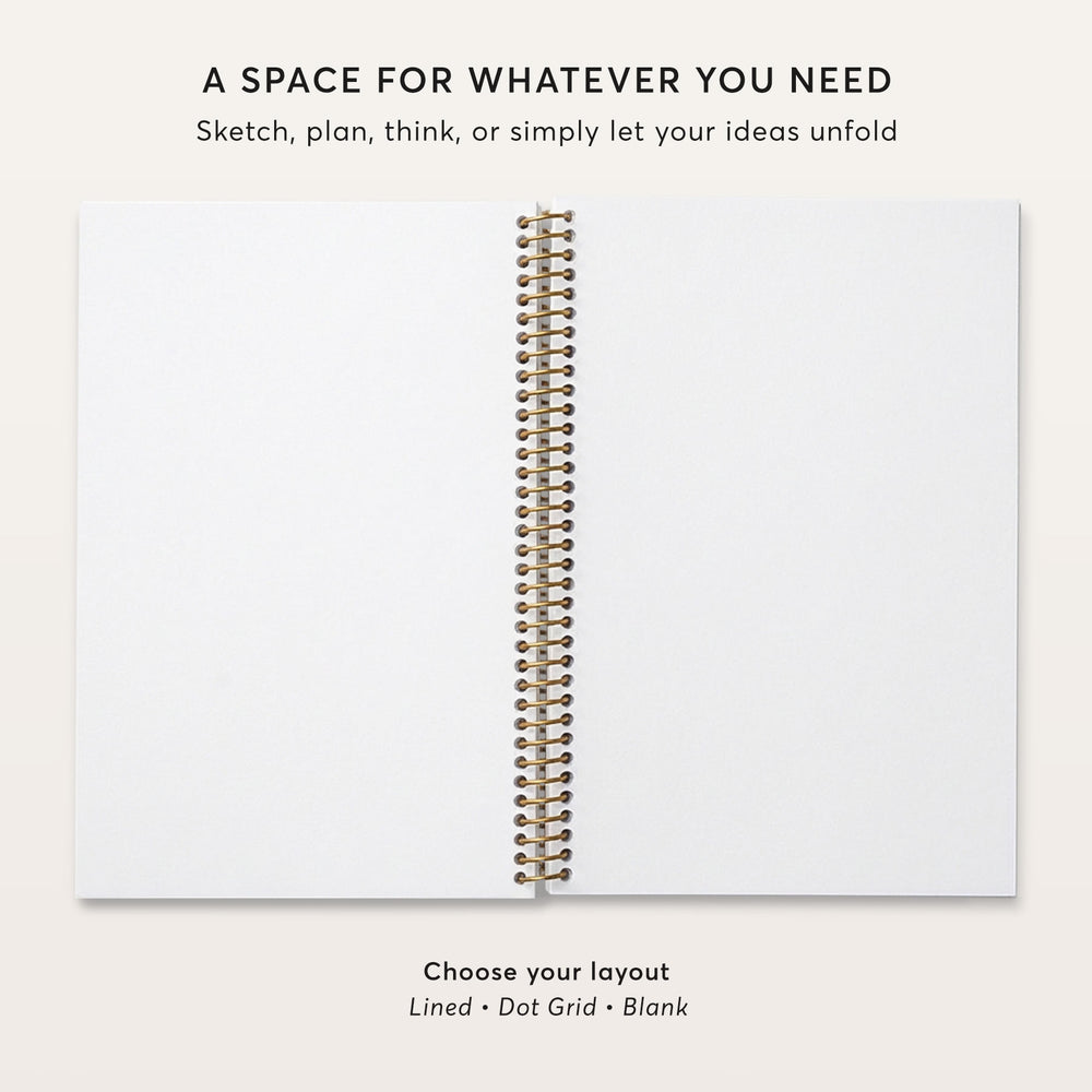 
                  
                    a blank spiral-bound notebook with a gold spiral binding, accompanied by text that provides a space for organizing ideas.
                  
                