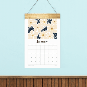 
                  
                    Animated preview of Artful Florals wall calendar pages with colorful flower illustrations and a wooden hanger.
                  
                
