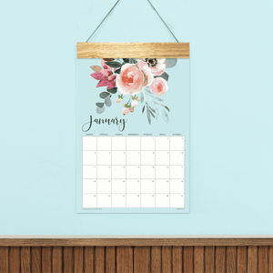 
                  
                    Animated preview of Floral wall calendar pages with watercolor flowers and a wooden hanger.
                  
                