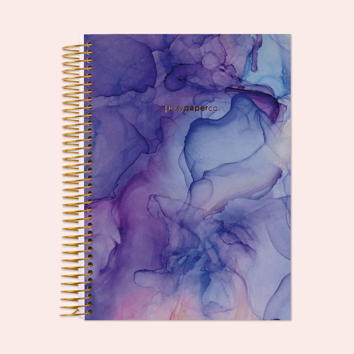 6×9 hardcover monthly planner with a Purple Flowing Ink cover and gold coil binding.