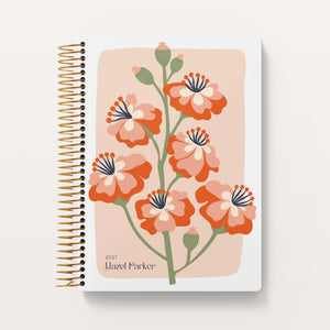 
                  
                    Secret Garden Coral Bloom cover on a 6×9 Posy planner
                  
                