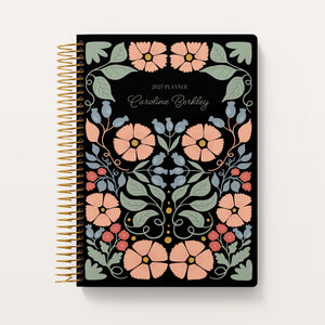 
                  
                    Secret Garden Midnight Garden cover on a 6×9 Posy planner
                  
                