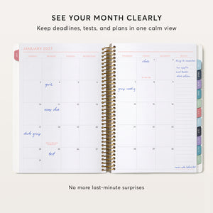 
                  
                    Open 6×9 student planner showing a January 2027 monthly calendar for deadlines, tests and plans.
                  
                