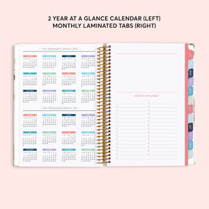 
                  
                    Two-year reference calendar beside a dates-to-remember page and colored month tabs.
                  
                