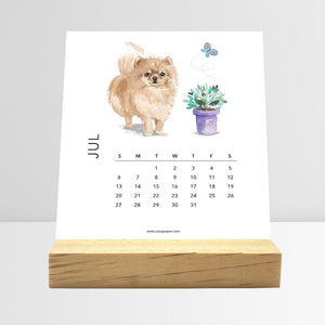 
                  
                    July Dog Breeds desk calendar card with a dog illustration
                  
                