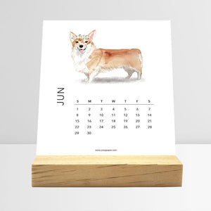 
                  
                    June Dog Breeds desk calendar card with a dog illustration
                  
                