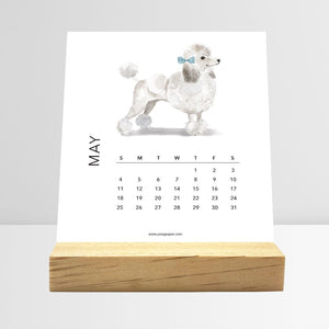 
                  
                    May Dog Breeds desk calendar card with a dog illustration
                  
                