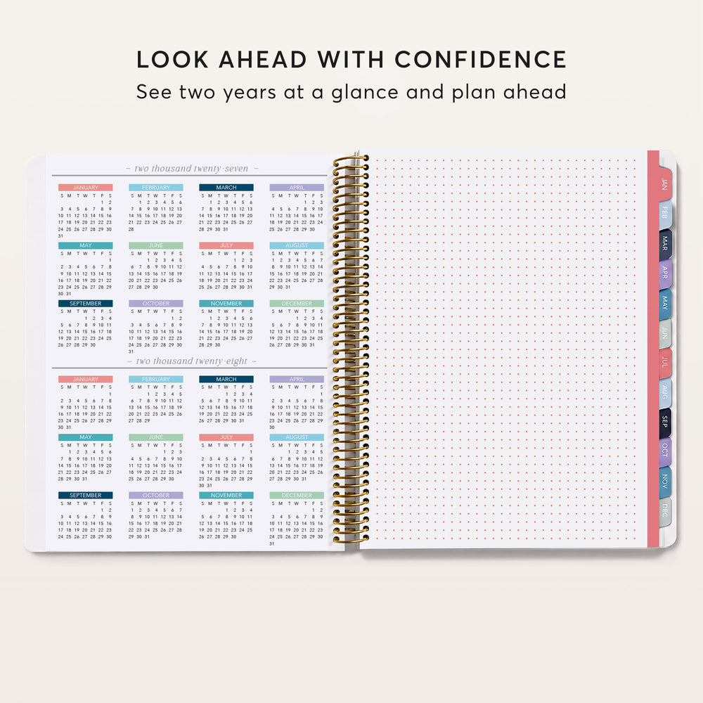 
                  
                    an open spiral-bound notebook with a calendar page inside, and a blank page on the right side. The text above the notebook reads "Look ahead with confidence See two years at a glance and plan ahead".
                  
                