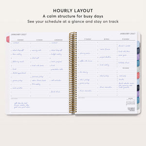 
                  
                    Open 8.5×11 weekly planner showing a January 2027 hourly layout with a schedule across the week.
                  
                