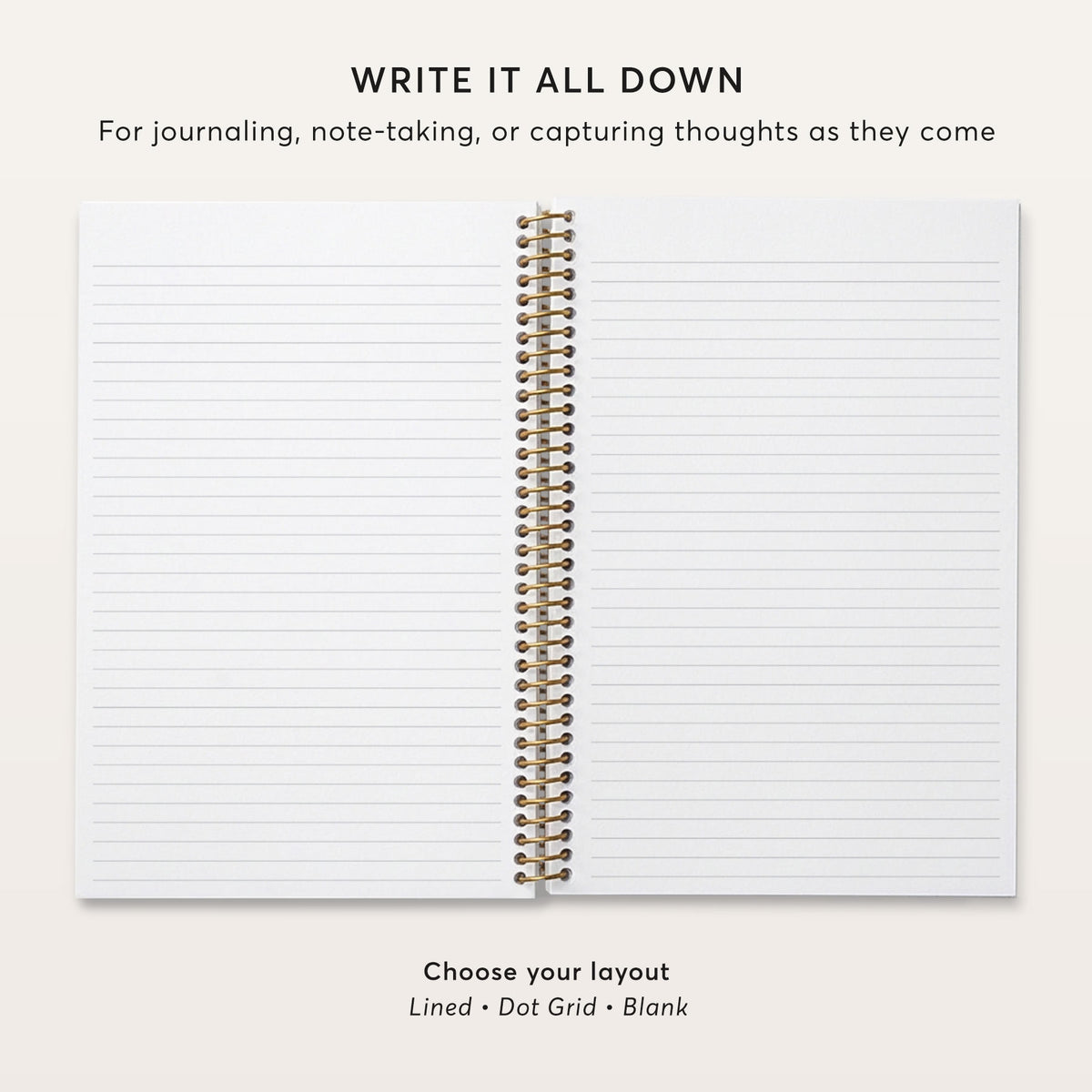 Open notebook showing lined pages and gold coil binding.