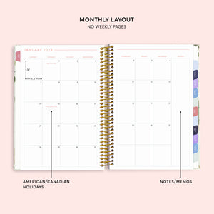 
                  
                    Two-page monthly calendar spread in a 6×9 hardcover Posy planner
                  
                