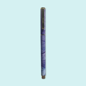 
                  
                    Posy Paper Co purple blue flowing ink rollerball point pen.
                  
                