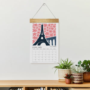 
                  
                    Travel wall calendar hanging with a January Eiffel Tower illustration
                  
                