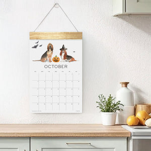 
                  
                    Loyal Companions October wall calendar hanging above a counter
                  
                