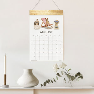 
                  
                    Loyal Companions August wall calendar with illustrated dogs above a shelf
                  
                