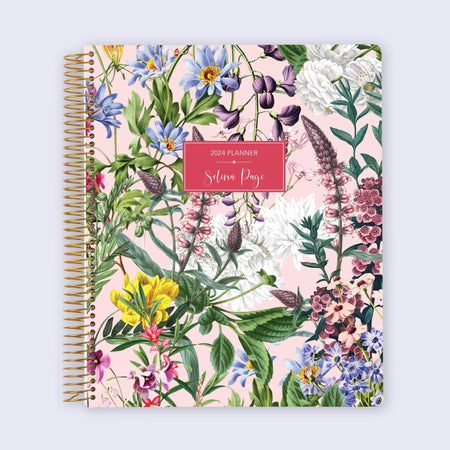 Academic planner with a pink floral cover, large 8.5x11 format, spacious layouts for assignments, and durable pages for a smooth writing experience.