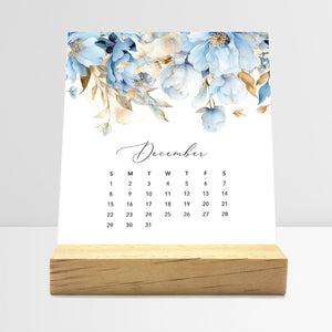 
                  
                    December Flirty Florals desk calendar card with watercolor flowers in a wooden stand.
                  
                