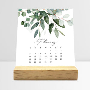 
                  
                    February Flirty Florals desk calendar card with watercolor flowers in a wooden stand.
                  
                