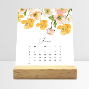 
                  
                    June Flirty Florals desk calendar card with watercolor flowers in a wooden stand.
                  
                
