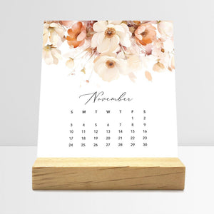 
                  
                    November Flirty Florals desk calendar card with watercolor flowers in a wooden stand.
                  
                