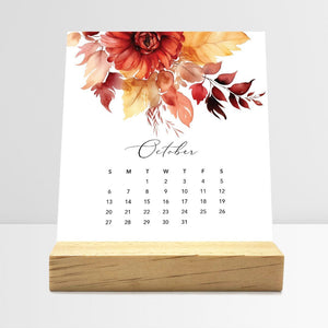 
                  
                    October Flirty Florals desk calendar card with watercolor flowers in a wooden stand.
                  
                