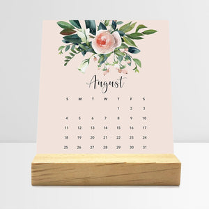 
                  
                    August Floral desk calendar card with watercolor flowers in a wooden stand.
                  
                
