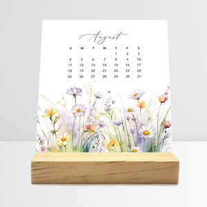 
                  
                    August Meadow Floral desk calendar card with watercolor flowers in a wooden stand.
                  
                