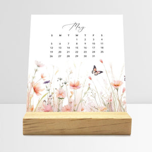 
                  
                    May Meadow Floral desk calendar card with watercolor flowers in a wooden stand.
                  
                
