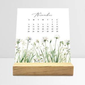 
                  
                    November Meadow Floral desk calendar card with watercolor flowers in a wooden stand.
                  
                