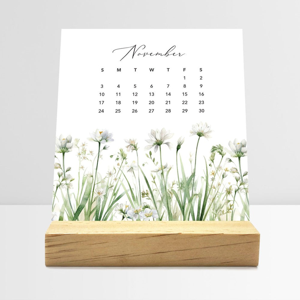 
                  
                    Posy Paper Co. 2024 desk calendar with meadow floral design displaying November dates.
                  
                