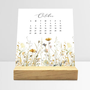
                  
                    October Meadow Floral desk calendar card with watercolor flowers in a wooden stand.
                  
                